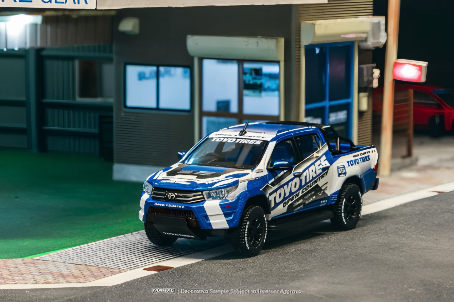 Tarmac Works 1:64 Toyota Hilux Blue/White